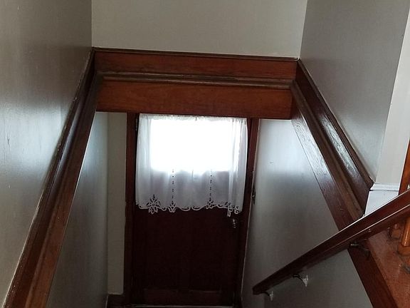 Stairs from the Dr/Lr leading to the front porch on Rutledge Avenue.