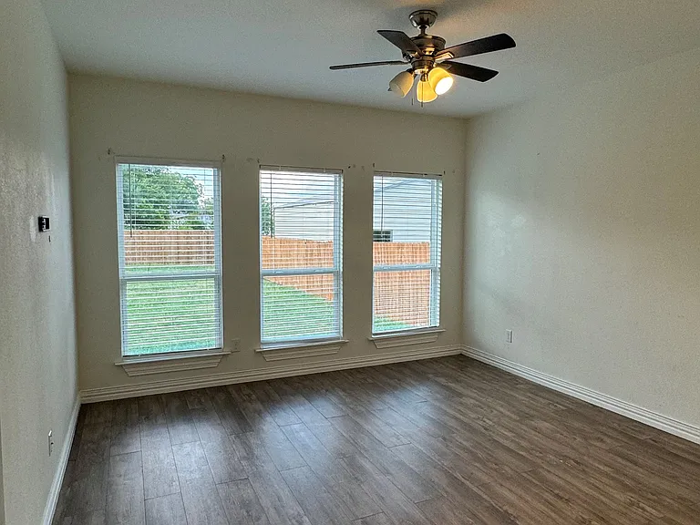 Master bedroom with view of the backyard.