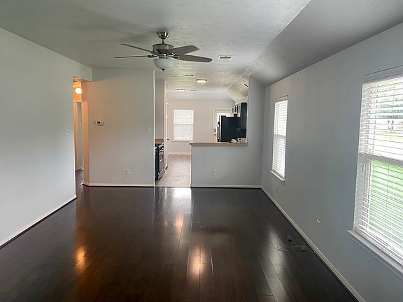 Open concept to the kitchen, high ceilings, nice flooring & fresh paint floor to ceiling.