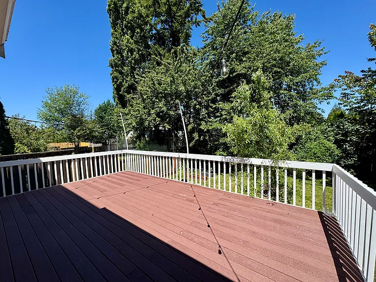 Oversized Back Deck w/ Steps to fully Fenced Backyard