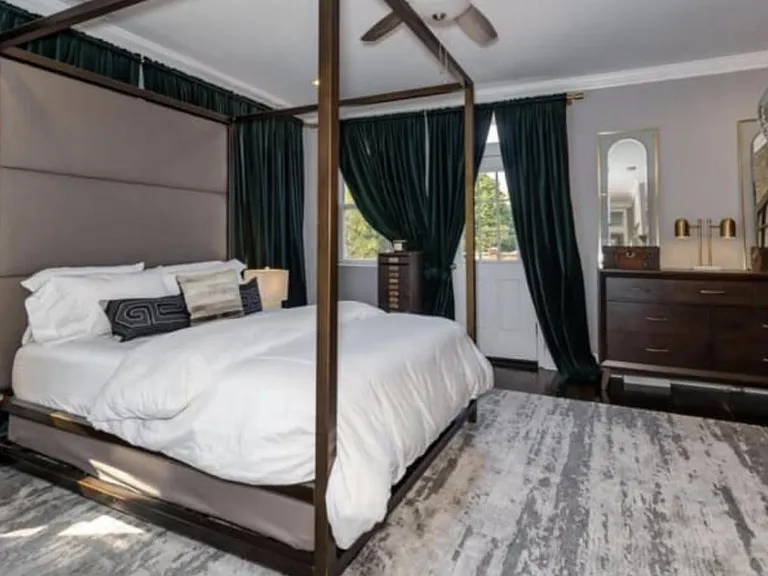 Bed and furnishings have been updated.