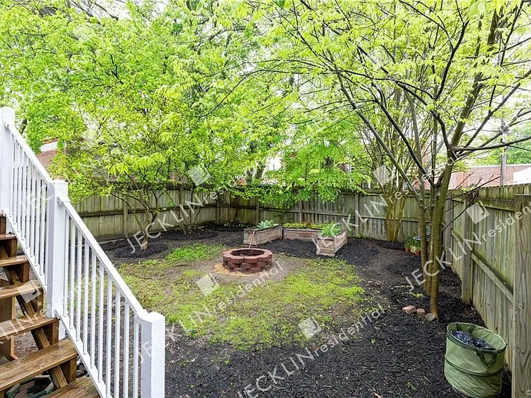 Shaded Fenced-in Yard with Fire Pit