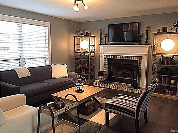 A woodburning fireplace is the focal point of the family room.
