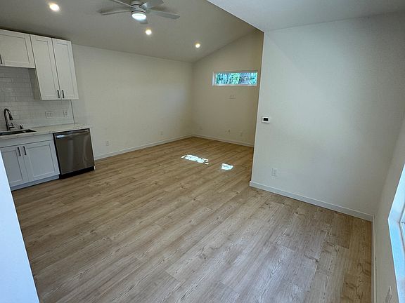 Entrance with view of open concept kitchen, dining/office and living space