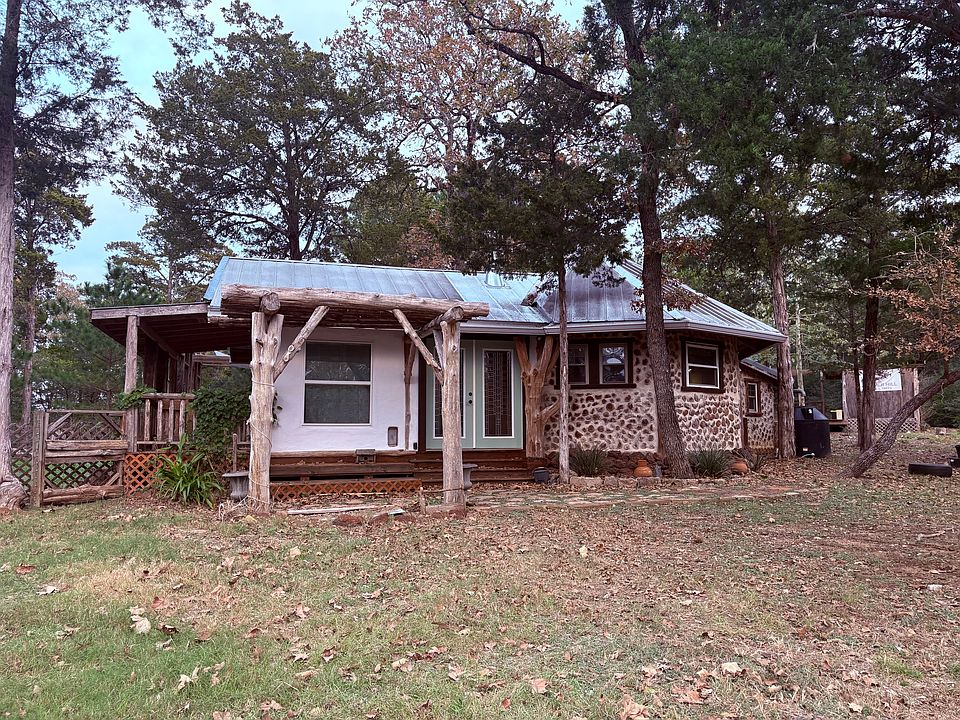 Main House -626 sq ft cordwood and cob house with a lofted sleeping area, living room, kitchen and bath.
