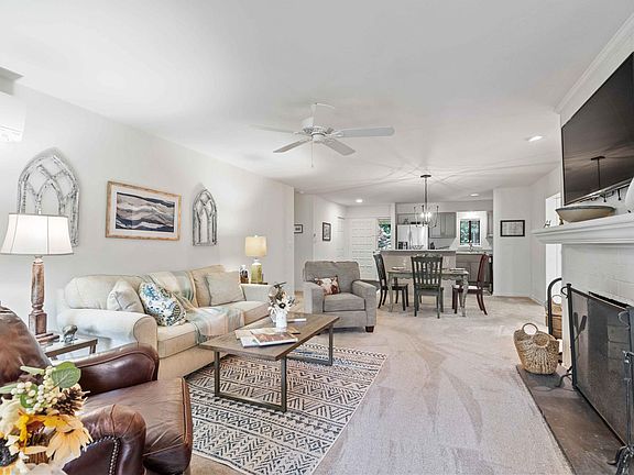 Living room with wood burning fireplace