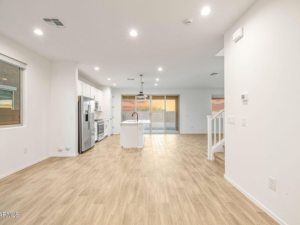 Entryway, dining area, and kitchen
