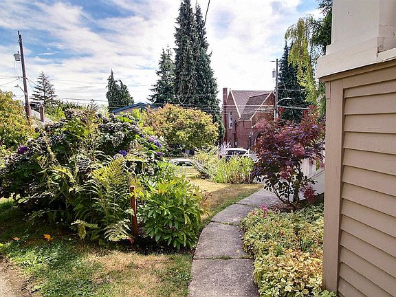 This is your sidewalk access along the north side which is partially covered by the roof eve.