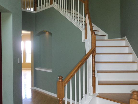 stairs up at entry. Now recently painted neutral off white color and awaiting new pictures