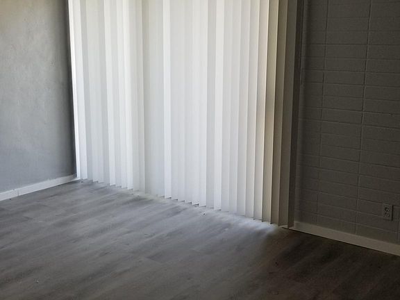 This is your bedroom area. The vertical blinds open to your Patio outside.
