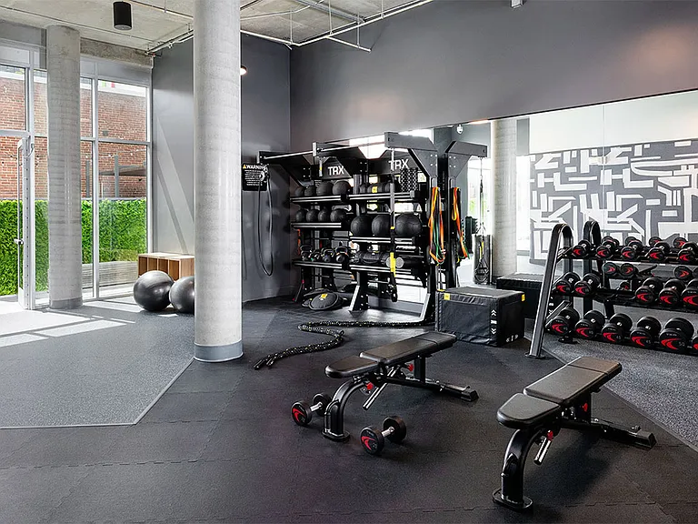 Apartment community 24-hour fitness center at Griffis East Village in San Diego, California.