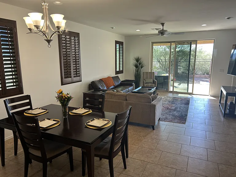 View from dining room to the retractable sliding door to access the landscaped, enclosed, back yard and native area