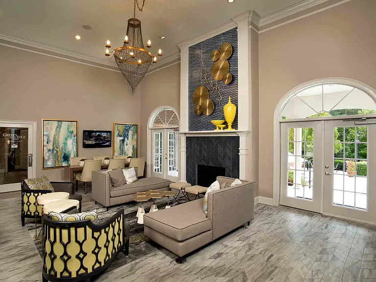 Resident lounge with fireplace and plush seating