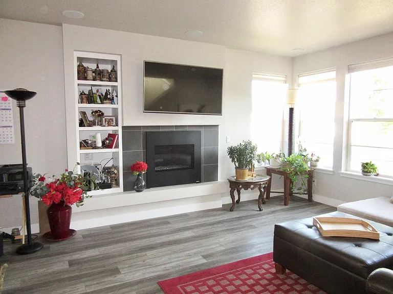 Living room with gas fireplace and TV