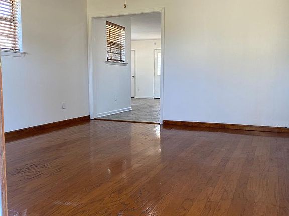 Living Room 12' X' 18' open to Wet Bar, Kitchen and Family Room. View from front door.