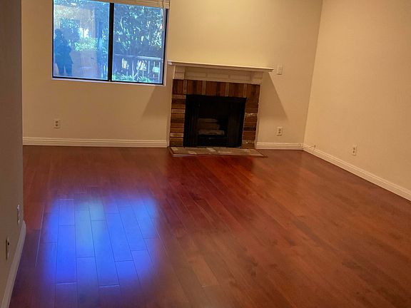Lovely Wood Floors and Cozy Fireplace
