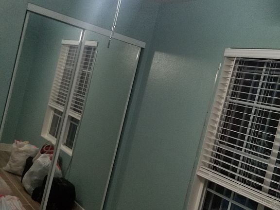 Closet doors have mirrors