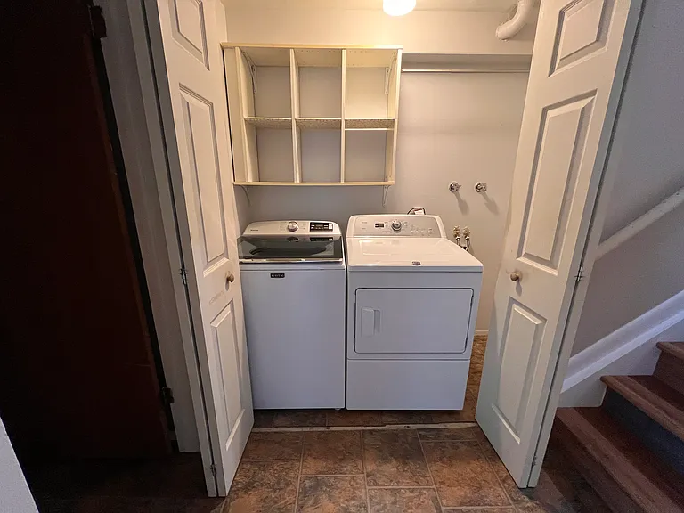 Full-size washer and dryer conveniently located on the garden level for easy access during extended stays.