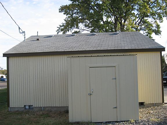 Storage shed in rear of home