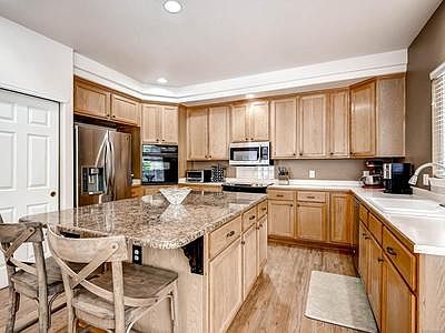 Large kitchen with stainless appliances and spacious island