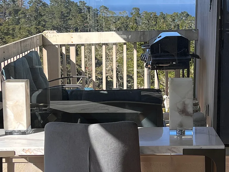 Beautiful dreamy ocean view from desk workspace and balcony with gas BBQ and seating for 4