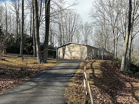 Paved driveway and fence