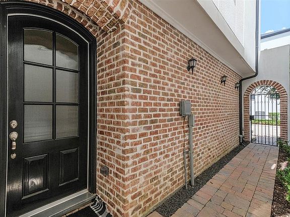 Private gated entry leads to front door.