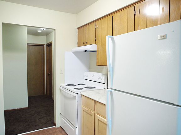Kitchen view two, bathroom at end of hallway and bedroom is the door on the right.