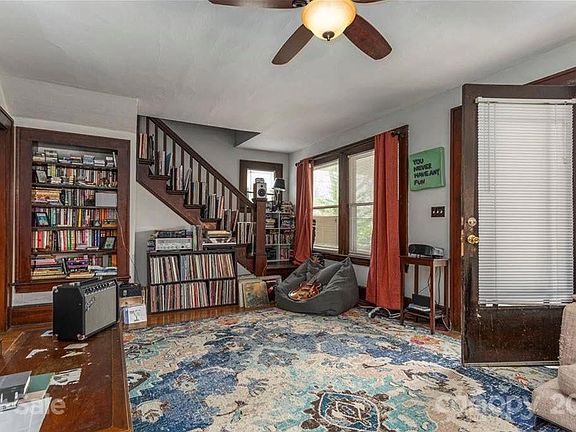 Other side of living room with front door to amazing private front porch