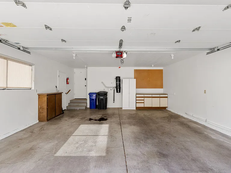 Two car garage for secure parking and added storage.