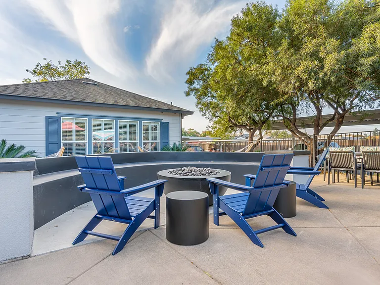 Our complex offers lounge chairs surrounding our pool deck's fire place