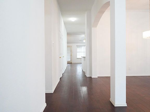Long hallway leads to a separate Family Living & Kitchen.