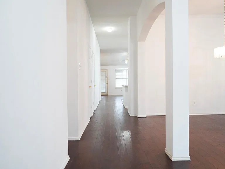 Long hallway leads to a separate Family Living & Kitchen.
