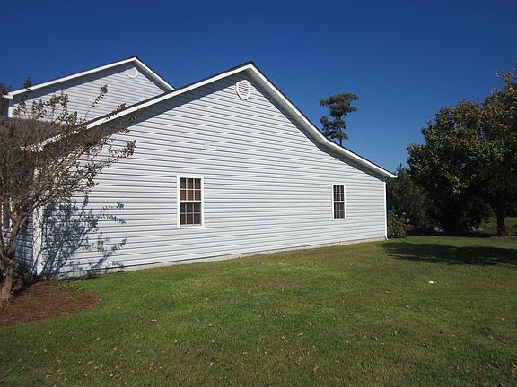 Side of home and green space