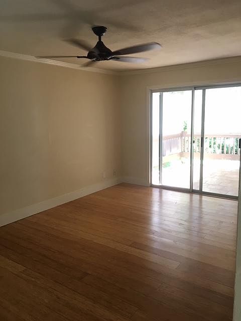 Bamboo floors, main room leading out to lanai.