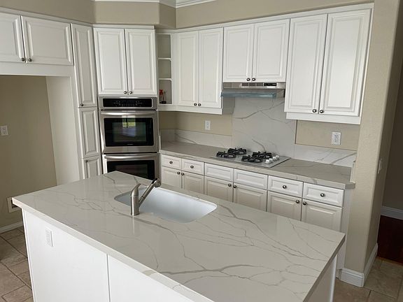 New kitchen countertops. Good size island. Deep sink. Double oven. Tenant to bring fridge.