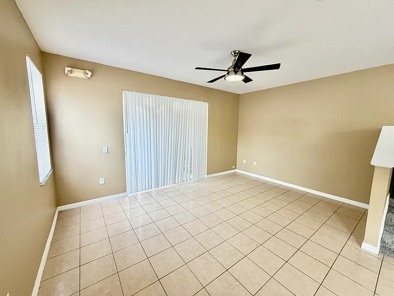 Great room with sliding glass door to private patio