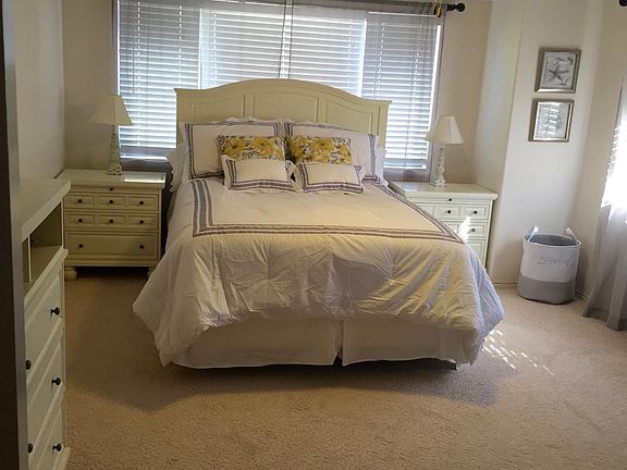 Large Master Bedroom with walk-in closet, double sink and bathroom. Bedroom now has King sized bed.