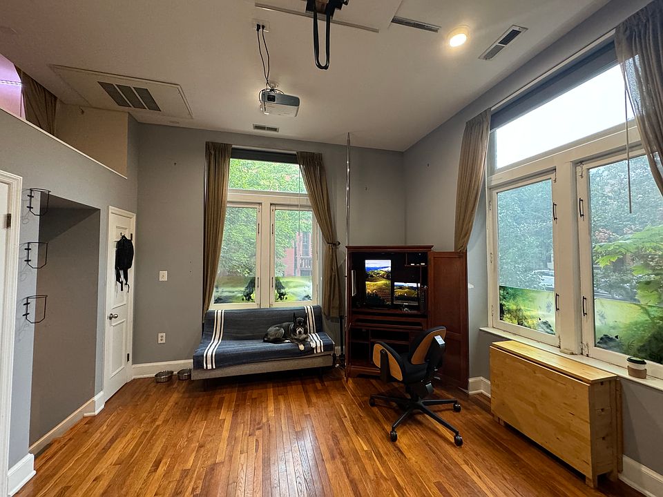 Incredible corner unit with tons of natural light. Beautiful mature trees seen from all windows.