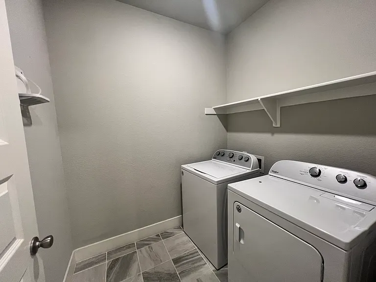 Separate laundry room.