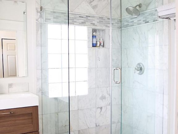 Both bathrooms have marble floors, stainless finishes and excellent storage