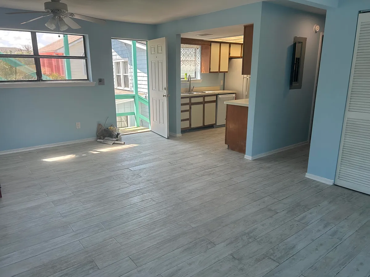 Entry into the living room with kitchen on left, hallway to second bedroom and bath. - 223 North St #1