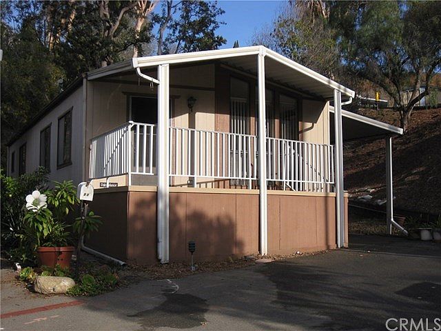 Double wide coach w/large front deck.  Private end location with a neighbor on one side only.