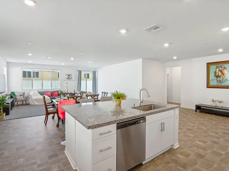 Stylish kitchen island with high chairs, perfect for casual meals and lively conversations!