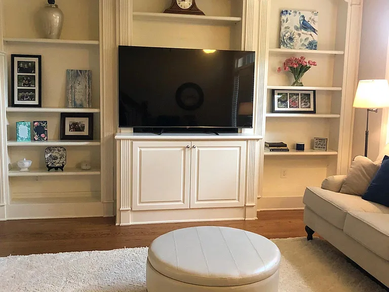 Living area with nice built-ins and lots of natural light.