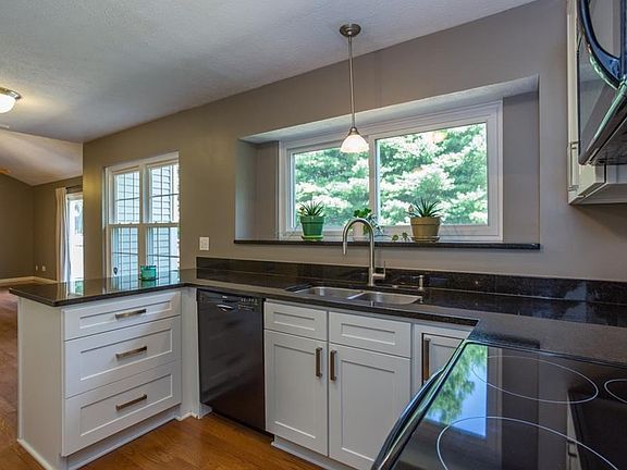 Wow, updated kitchen with new appliances, cabinets, sink, faucet and granite counters.  Nickel appointments throughout home.