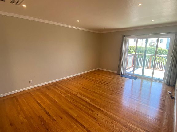 Living room with glass slider to deck