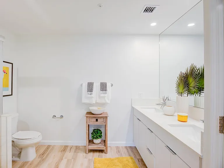 East Phase Bath with white cabinetry, white countertop, and hard surface flooring