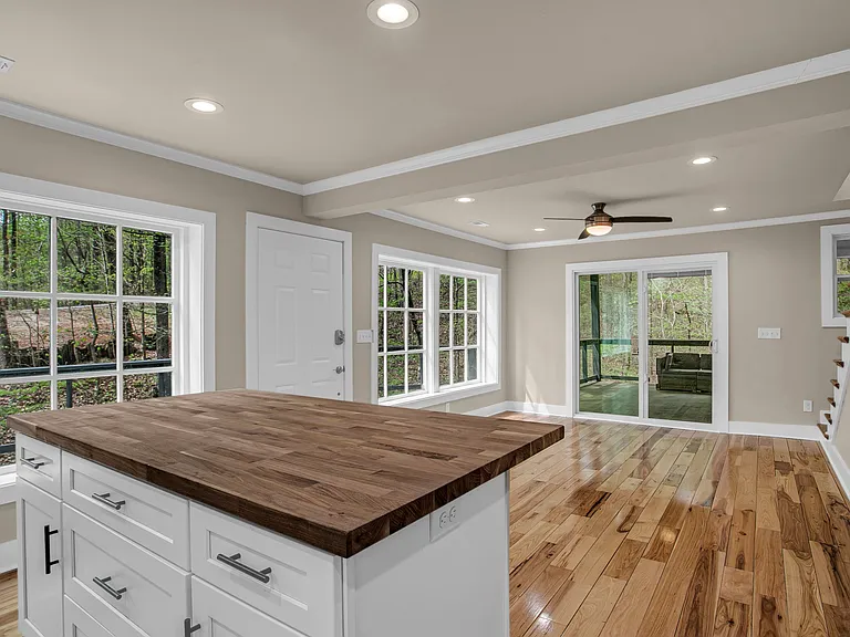 Stainless steel appliances. Maple Butcher block counter top for Island and quartz countertops.