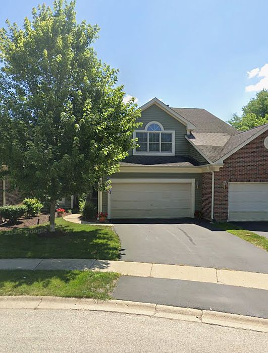 Front on townhome with two car garage. Located in a circle drive.